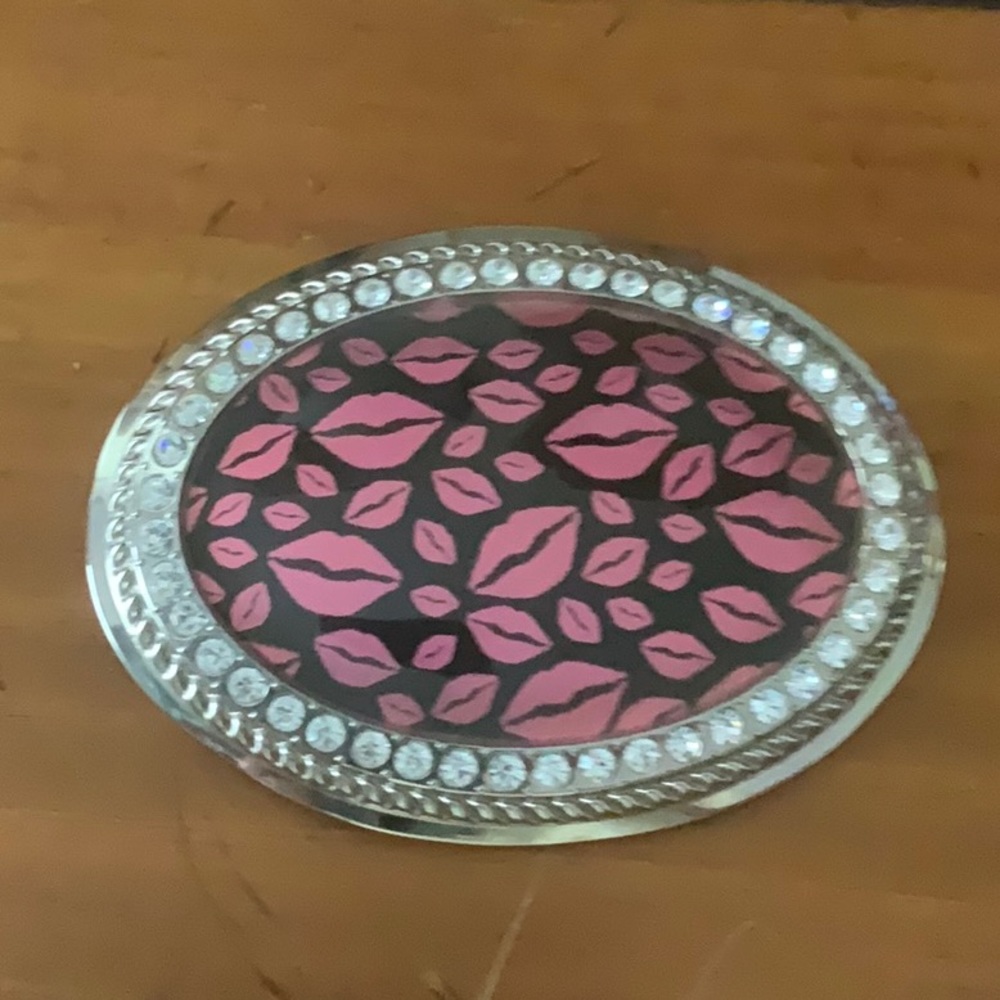 Metal, resin and rhinestone belt buckle.
